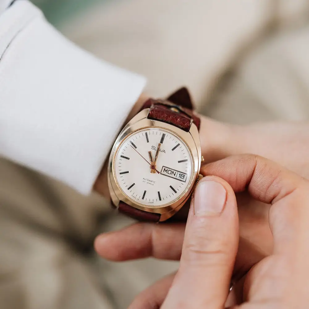 Man adjusting watch